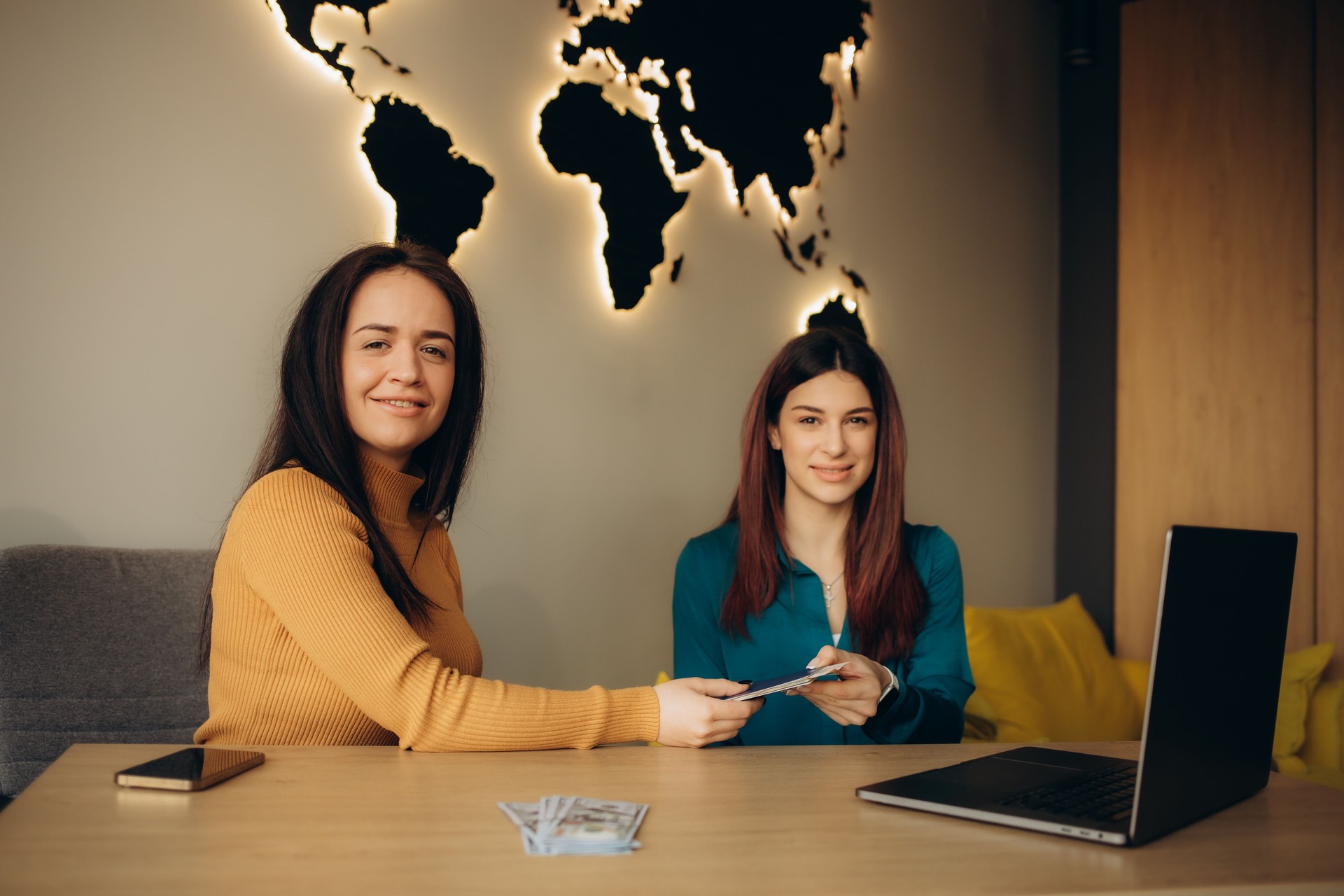 A young girl came to a travel agency. She wants to make journey. The travel agent helps her.